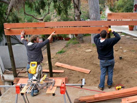 How to Build a Horizontal Plank Fence in a Hillside Backyard