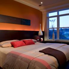Masculine Orange Bedroom With Dramatic Lighting