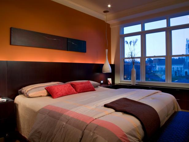 Orange Contemporary Bedroom With Dark Wood Furnishings