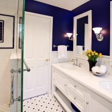 Blue and White Bathroom With Yellow Tulips