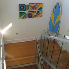 light balances beach house stairwell