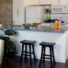 white kitchen cabinets compliment loft design