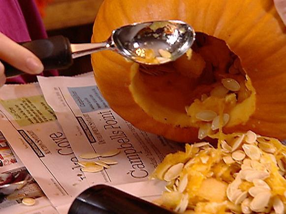 Removing Pumpkin Seeds With Ice Cream Scoop