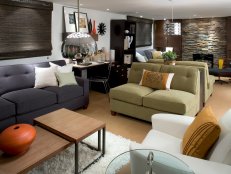 White Bonus Room With Green Loveseats, Desk Area and Stone Fireplace