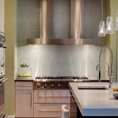 Green Kitchen With Contemporary Range Hood