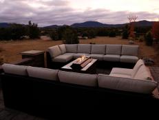 Designed as an outdoor living room and social space, the back patio welcomes guests with comfortable seating and breathtaking mountain views.