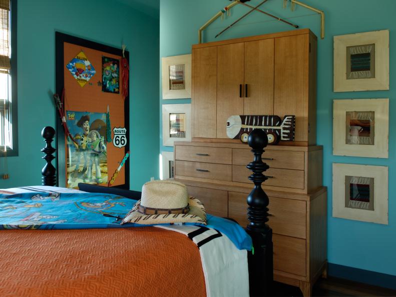 Blue Bedroom With Orange Bed, Memo Board & Toy Story Posters