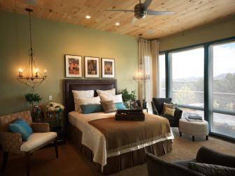 Green Bedroom With Wood Ceiling, Leather Headboard and Large Windows