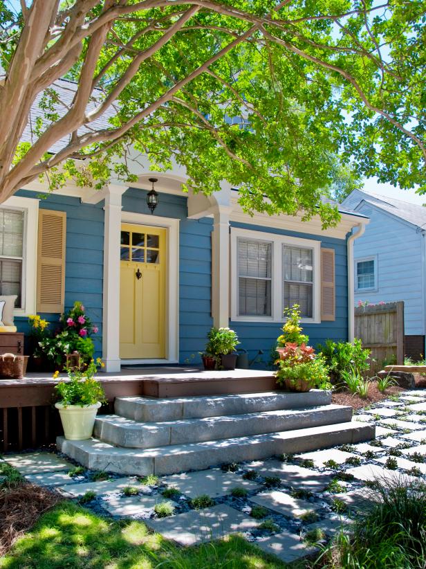 Blue house With Yellow Front Door, Granite Steps and Cobblestone Path