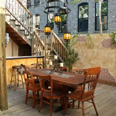 Tuscan-Inspired Outdoor Dining Area With Rustic Table
