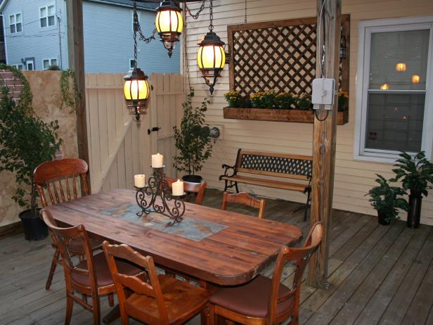 Tuscan Patio Dining Area With Rustic Wood Table and Lantern Chandelier