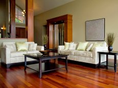 Brown laminate flooring in a living room. 