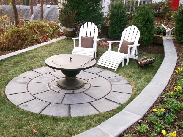 Transitional Outdoor Space With Fire Pit & White Wood Chairs