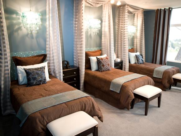 Contemporary Blue Bedroom With Brown Bedding and Multiple Twin Beds