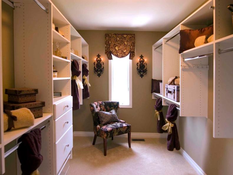 Room-Sized Closet With White Shelving Space and Purple Floral Chair
