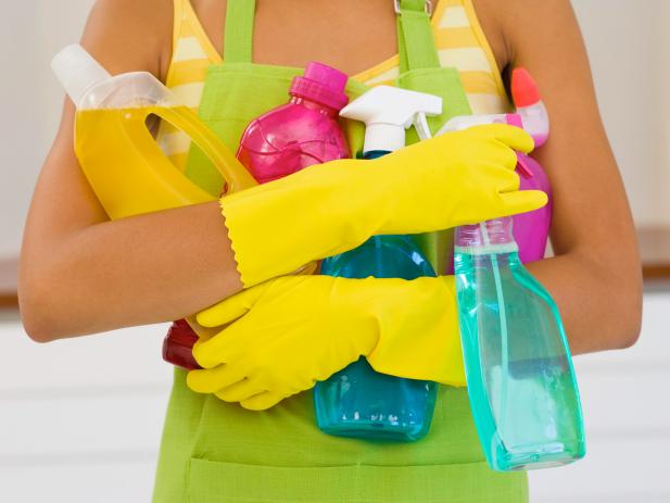 Woman Holding Cleaning Supplies