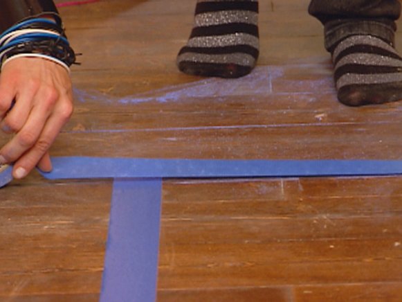Blue Painter's Tape Outlining Faux Painted Rug Area