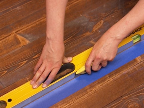Scoring Painter's Tape for Faux Painted Rug on Wood Floor