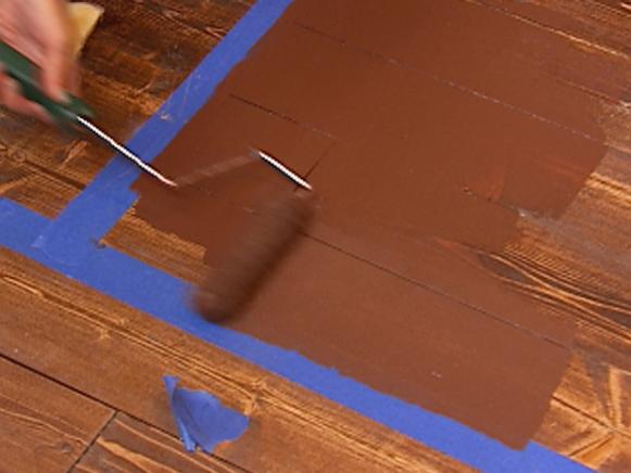 Roller Painting Wood Floor Brown With Painter's Tape