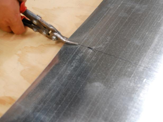 Use tin snips to cut the flashing to size