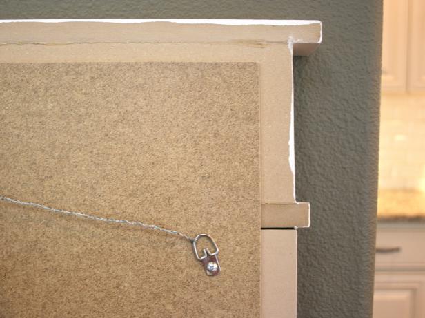 Attach hanging hardware to chalkboard backing