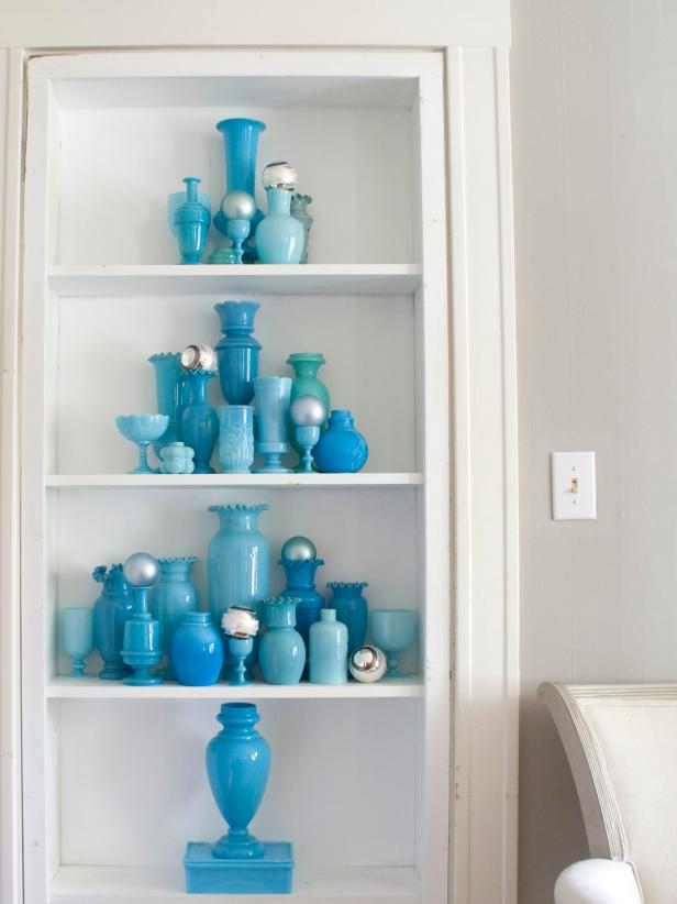 White Built-in Bookshelf With Blue Vases & Silver Christmas Ornaments