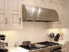 Stainless Steel Cook Range and Hood With Marble Countertops 