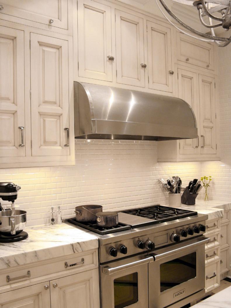 Stainless Steel Cook Range and Hood With Marble Countertops 