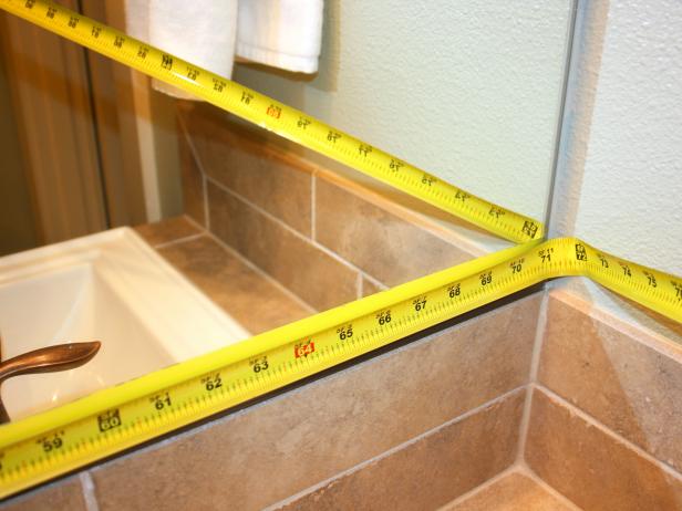 Measuring Tape Against Bathroom Mirror