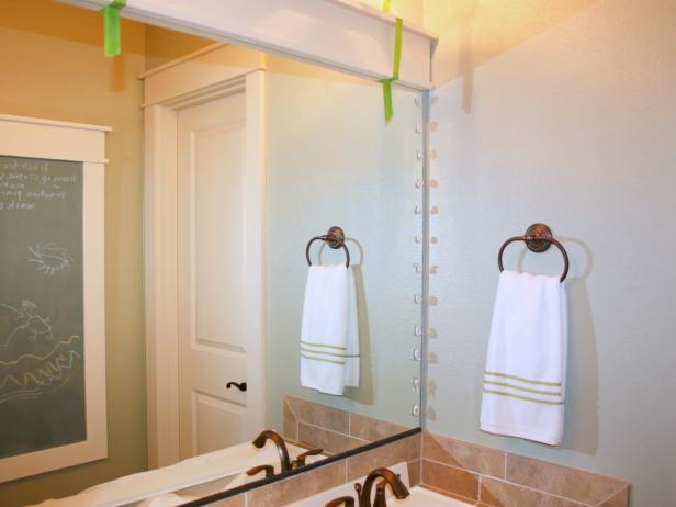 Bathroom Mirror With White Trim on Top With Green Tape