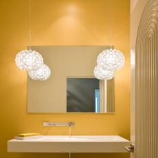 Contemporary Yellow Bathroom With Floating Sink
