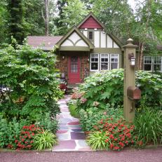 Tudor Revival Home With Stone Walkway