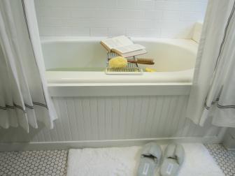 Traditional White Bathroom Tub Surrounded By Beadboard