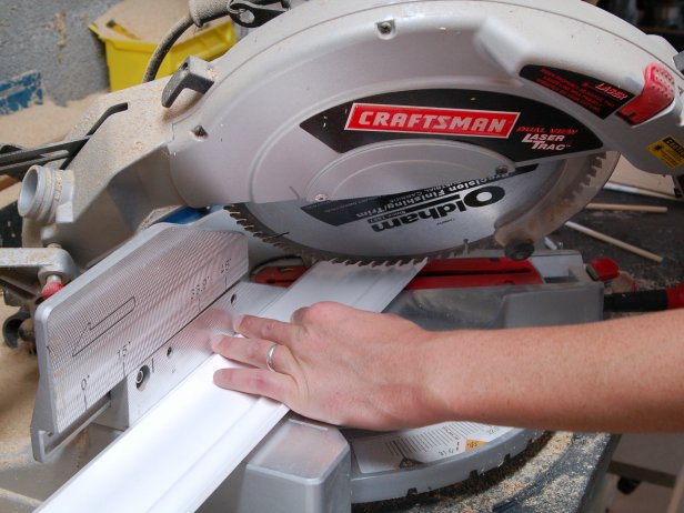 Trim the crown molding with a miter saw to specifications of shelving unit.