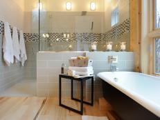 Light Gray Tiled Bathroom With Vintage Tub
