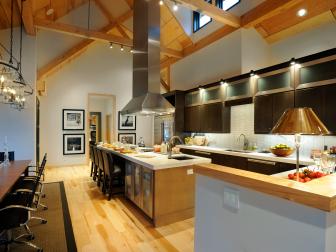 Contemporary Kitchen With Wood Ceiling Beams and Black Cabinets