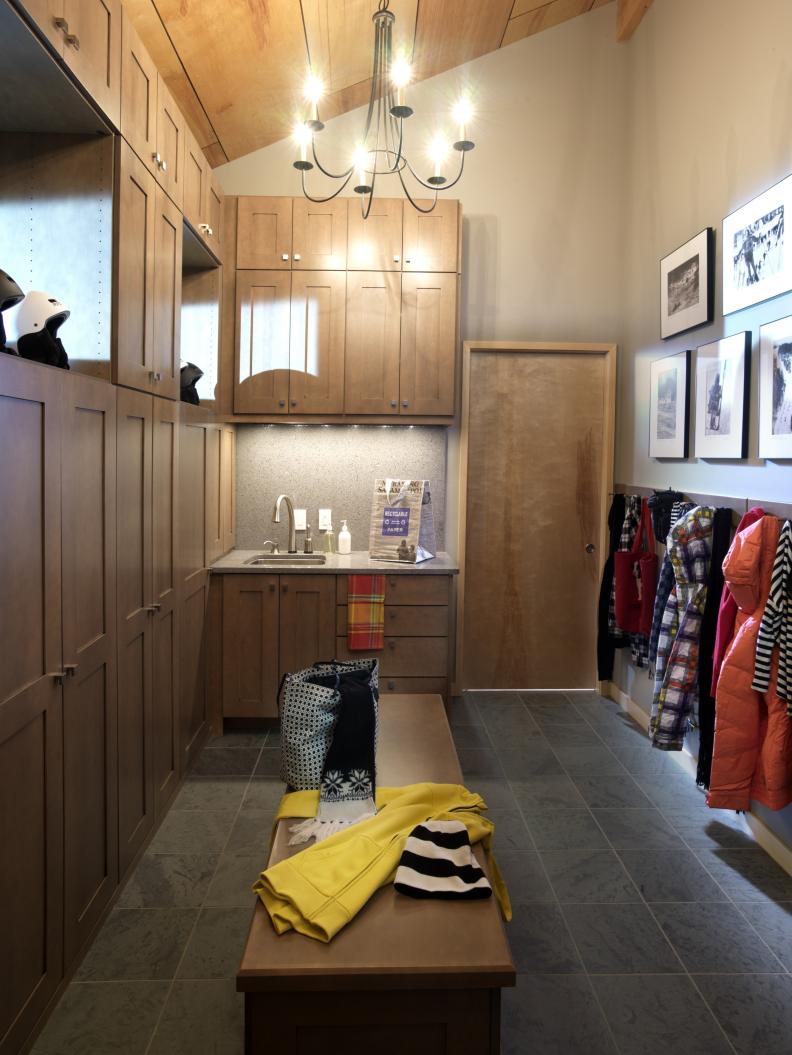 Mudroom With Floor-to-Ceiling Maple Cabinets and Iron Chandelier