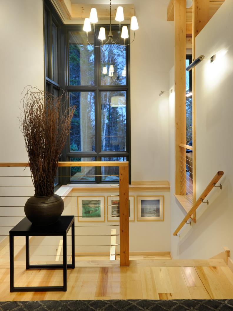 Modern Entryway Stairwell With Light Wood Handrails