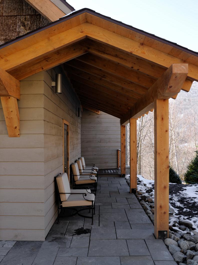 Natural stone patio with wood beams