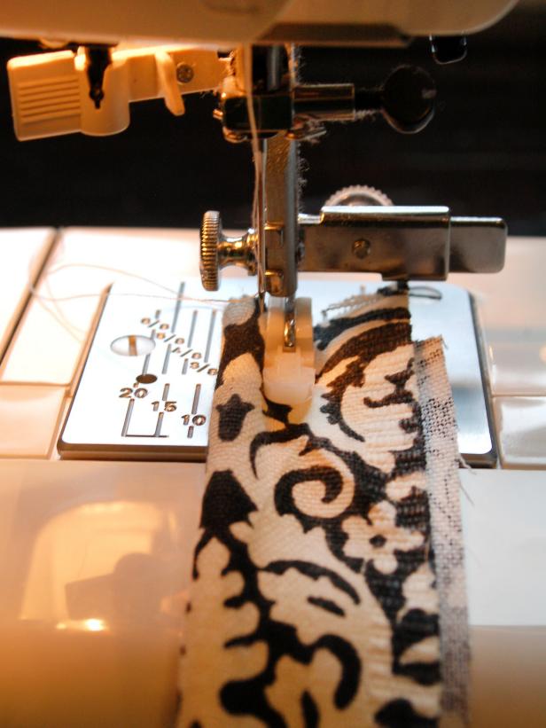 Sew piping into place using a zipper foot.