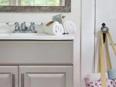 Gray Shabby Chic Bathroom Vanity With Mirror Reflecting Backyard View