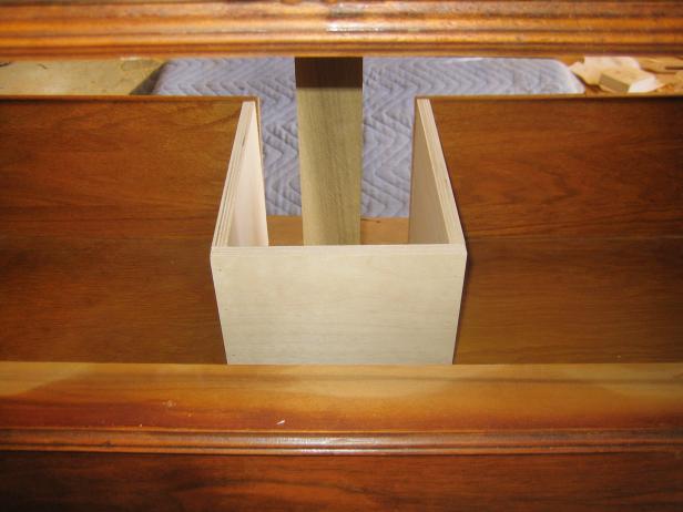 Build a frame that surrounds the cutout on the drawer, keeping it the same height as the existing drawer. This will allow for functional, sliding drawers.