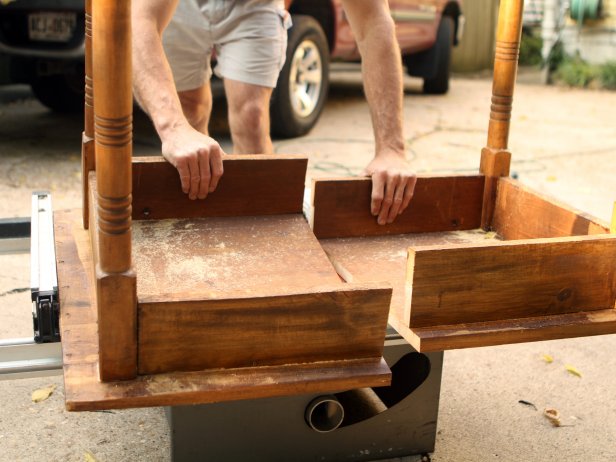 Next, use the table saw to cut the table in half. Each half will become a nightstand with the legless end supported by a wooden cleat attached to the wall.