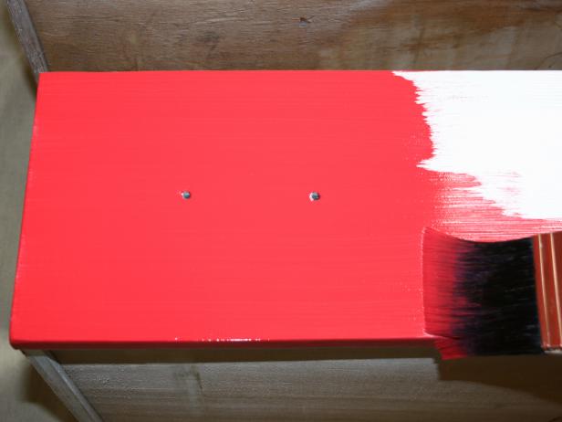 Applying Red Paint to Dresser