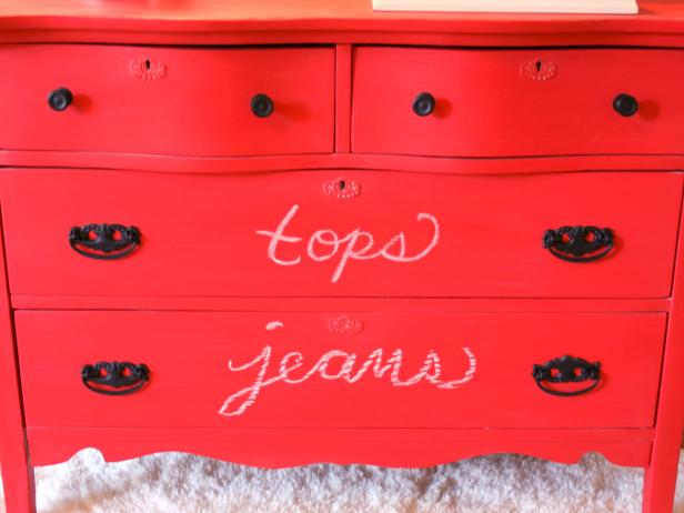 Red Dresser With Labeled Drawers