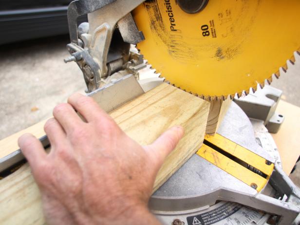 Sawing the Wood Posts With Chop Saw
