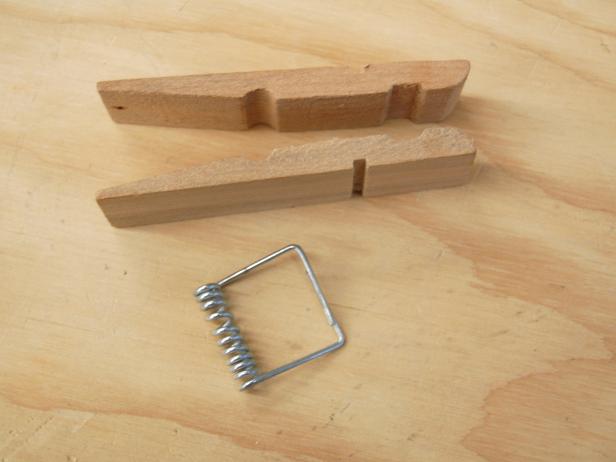Remove spring from each clothespin and brush the clothespins and yardstick with soft bristled brush to remove any debris.