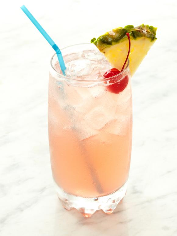 Pink Cocktail With Pineapple Garnish 