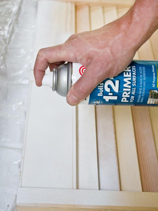 Hand Spraying Primer on Unfinished Wood Shutter