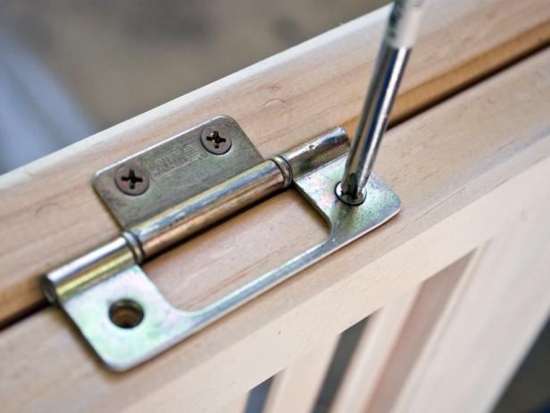 Remove hinges and door knobs to prepare for paint.